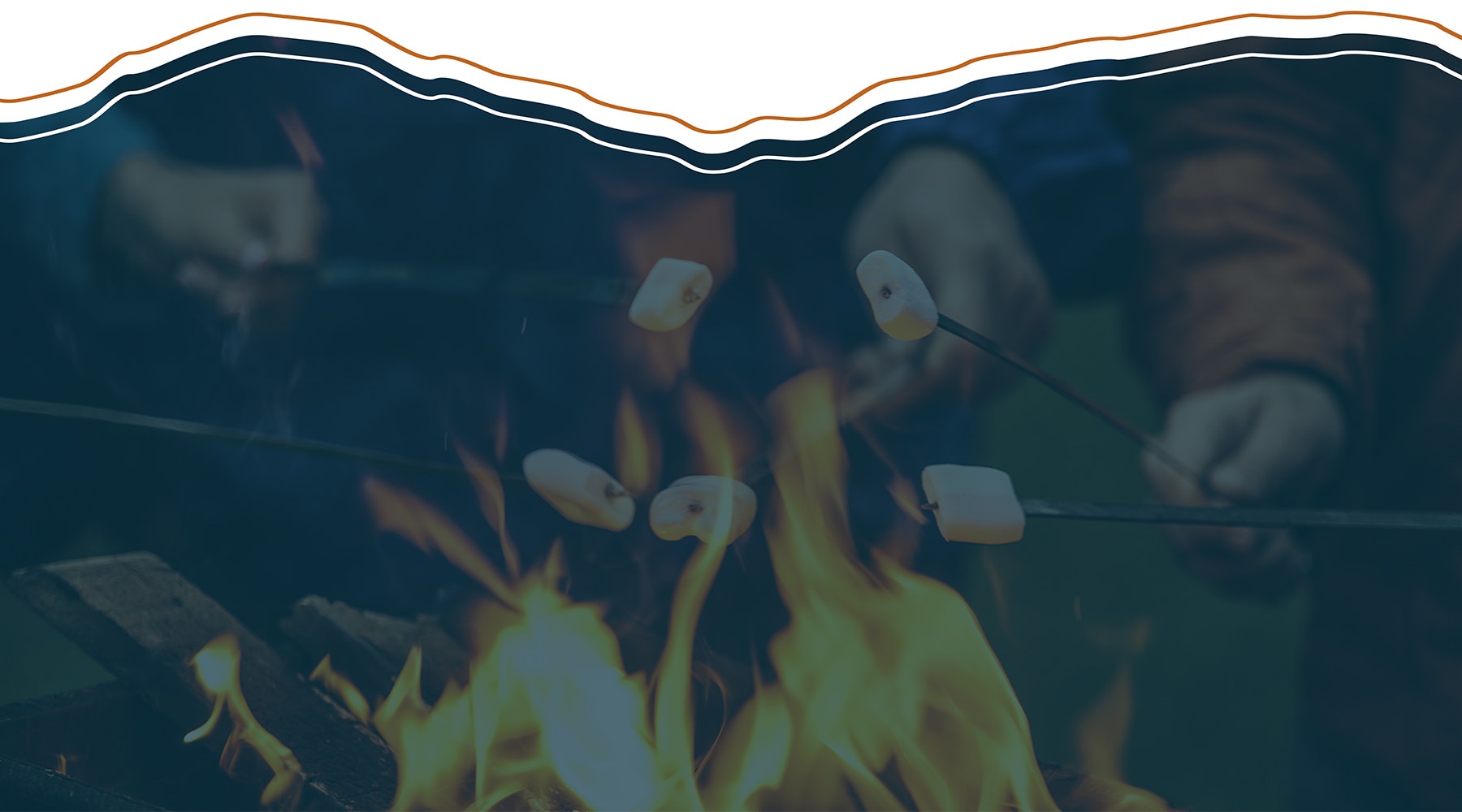 Love where you live people roasting marshmallows over a fire