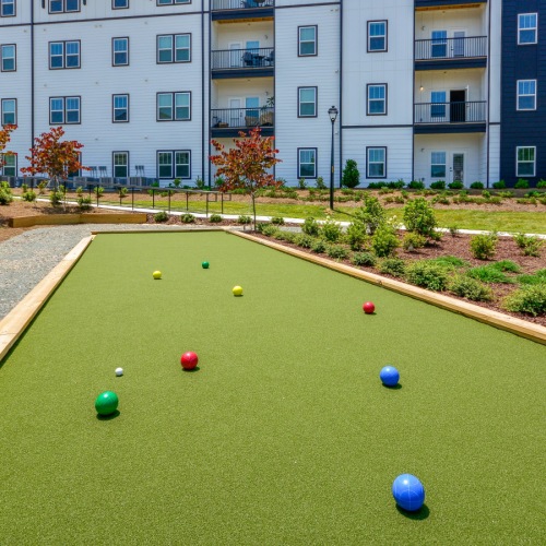 Bocce Ball Court  A bocce ball course with green grass and red and blue balls.